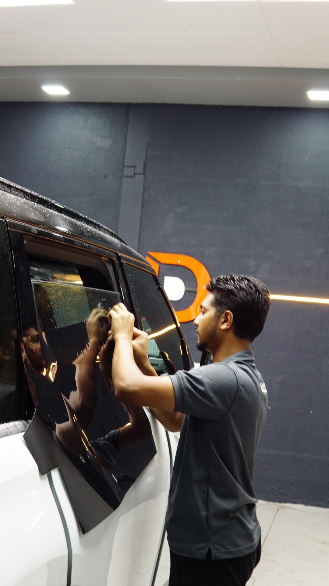 Window tint installation at Detailing Dynamics Dubai